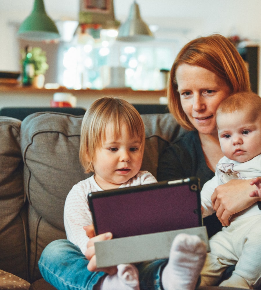 Family checking their gift card balance together on a laptop